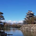 Matsumoto Castle in winter surrounded by snow capped mountains