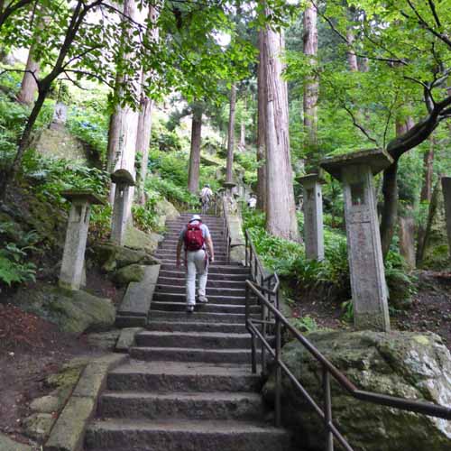 a man walking on steps of yamadera (Risshakuji) in Yamagata