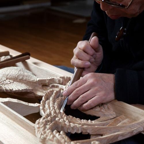 Woodcarving artisan at work in Inami, Toyama prefecture